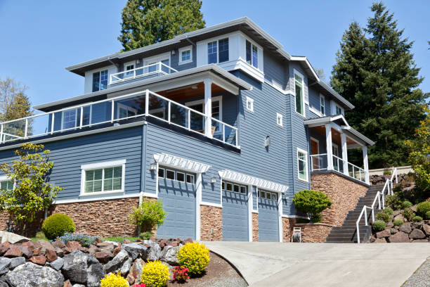 Blue-gray home exterior with white trim and clean finishes by a house painter in Corvallis, OR.