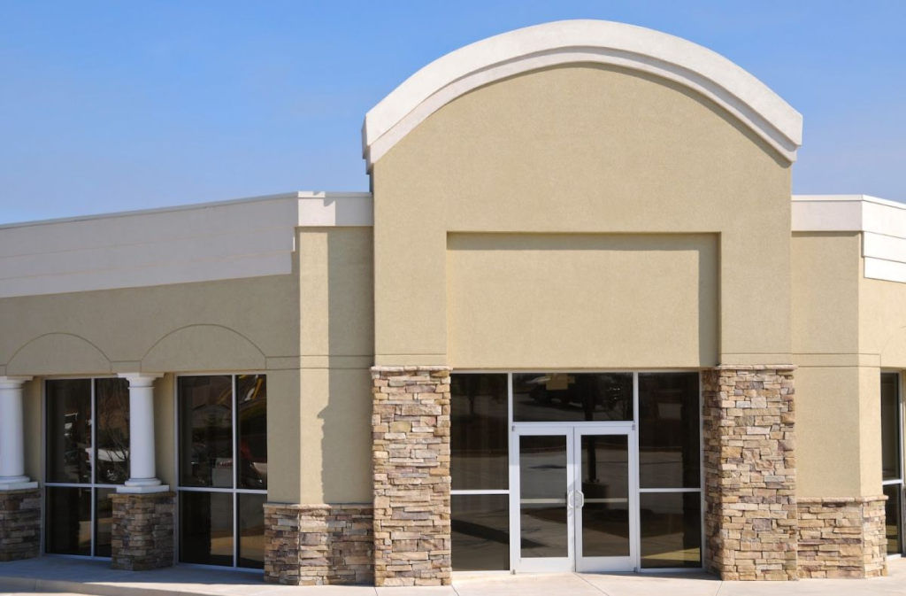 Beige building exterior with fresh paint, decorative stone accents by a painter in Corvallis, OR.