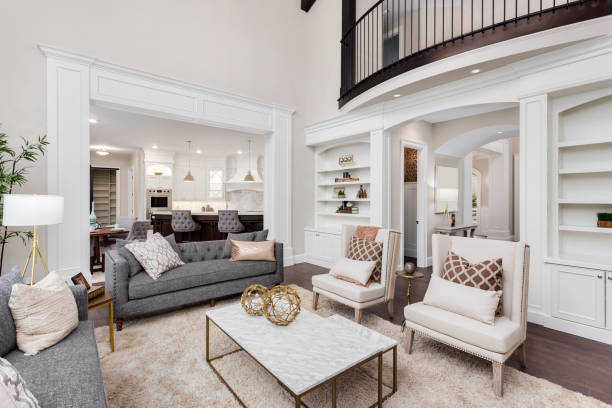 Living room with soft white walls, decorative trim, and elegant finishes by an interior painter in Albany, OR.