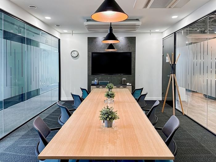Office conference room with crisp white walls and professional interior finishes by a painting company in Dallas, OR.