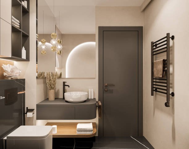 Modern bathroom with warm beige walls and black accents by an interior painter in Monroe, OR.